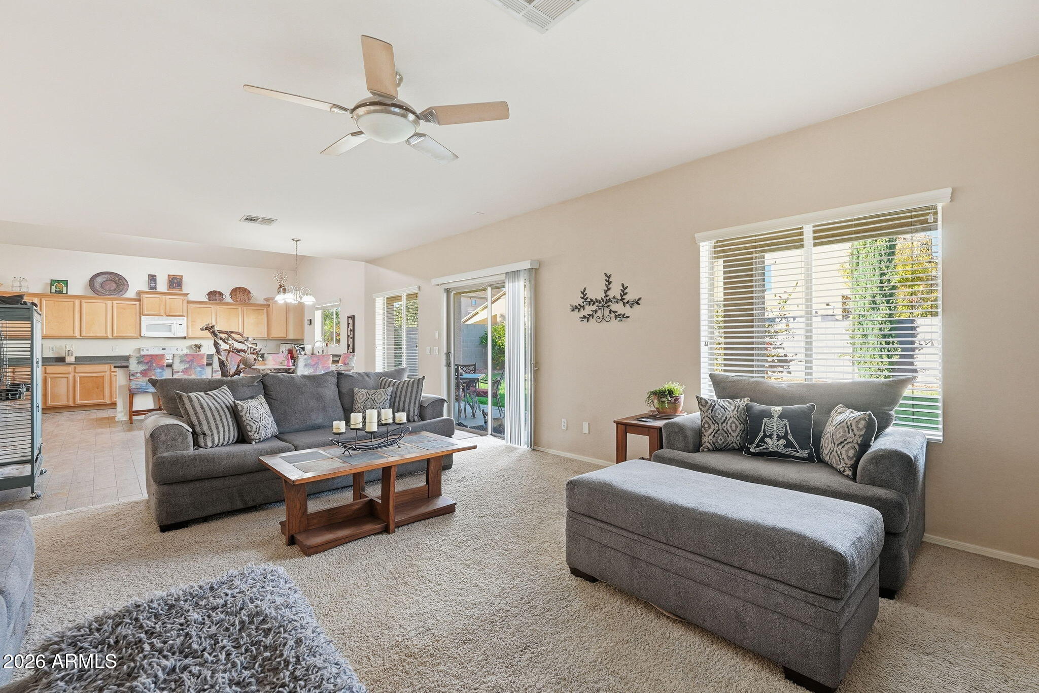 17760 West Charter Oak Road Surprise, AZ 85388 - Photo 10 of 45 a living room with furniture and a large window