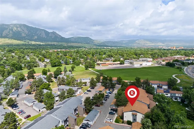 a view of a city with mountains in the background