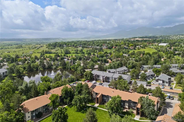 an aerial view of a house with lots of residential buildings