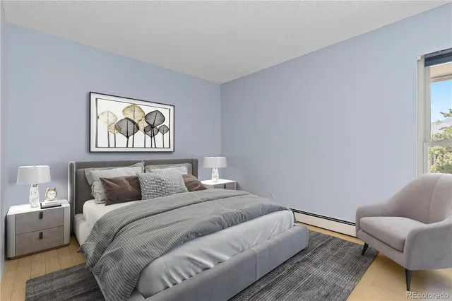 a bedroom with furniture and a window