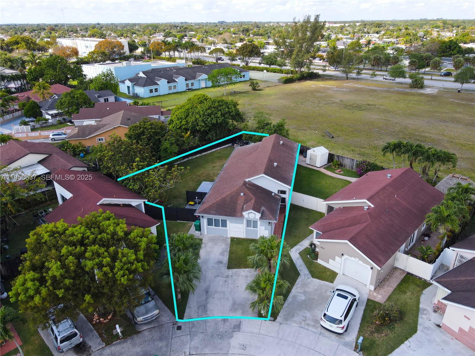 11518 Southwest 174th Street Miami, FL 33157 - Photo 1 of 27 an aerial view of residential houses with outdoor space and ocean view