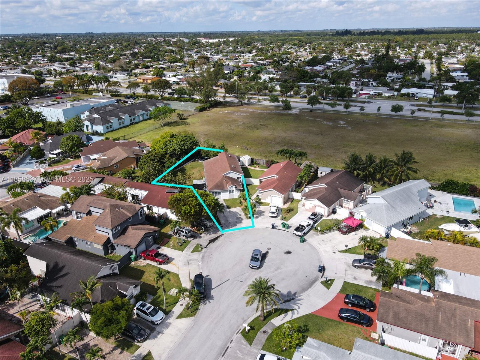 11518 Southwest 174th Street Miami, FL 33157 - Photo 2 of 27 an aerial view of residential houses with outdoor space