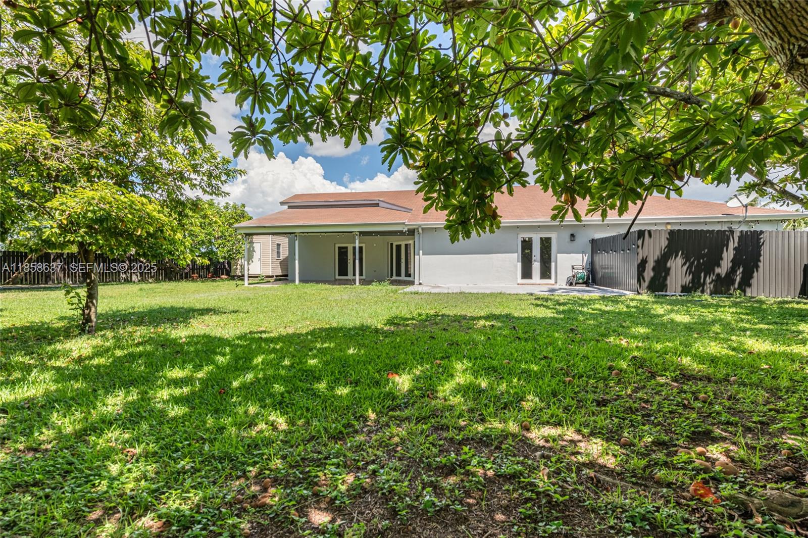 11518 Southwest 174th Street Miami, FL 33157 - Photo 24 of 27 a front view of a house with a yard