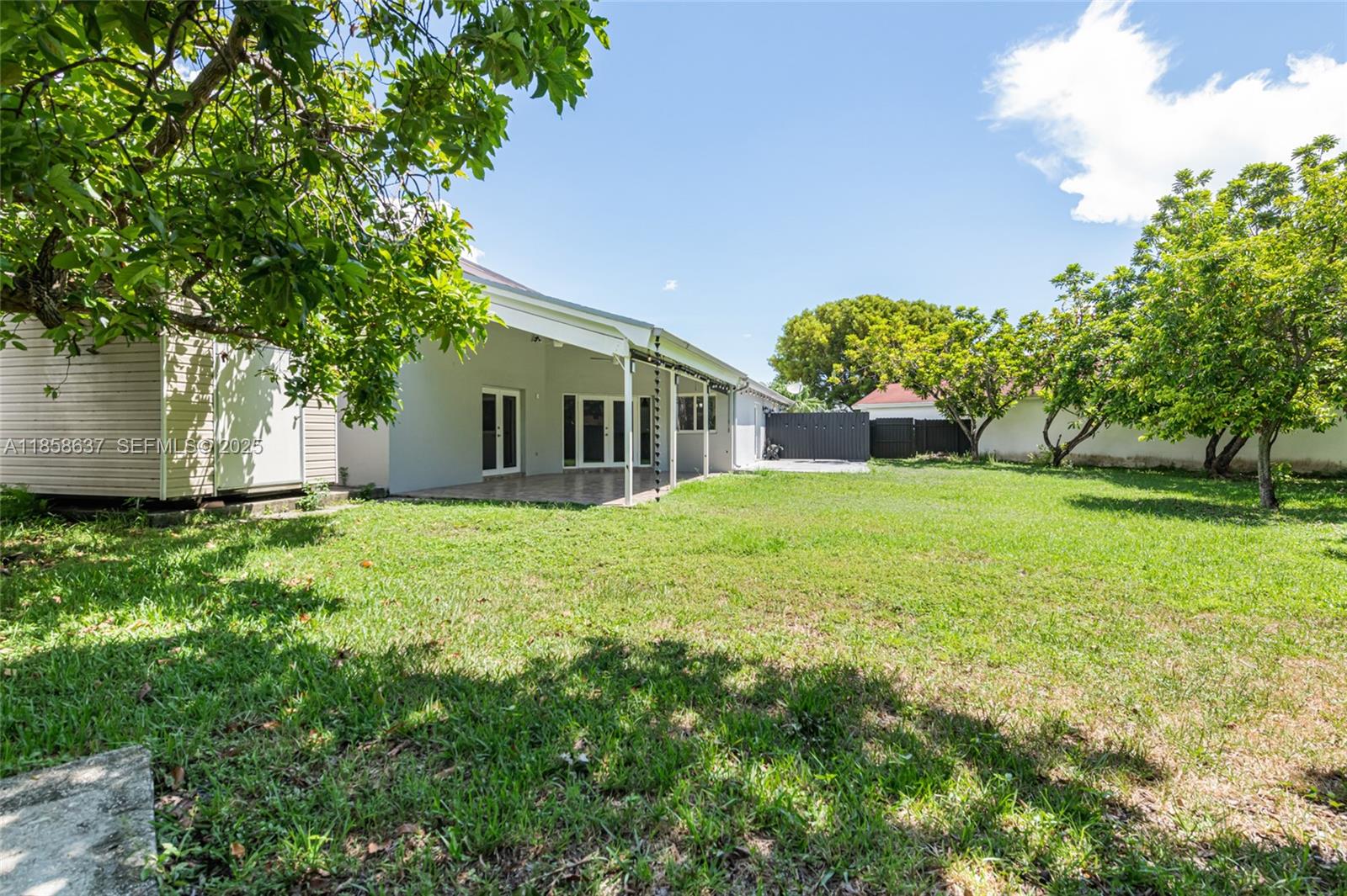 11518 Southwest 174th Street Miami, FL 33157 - Photo 25 of 27 a view of a house with a yard