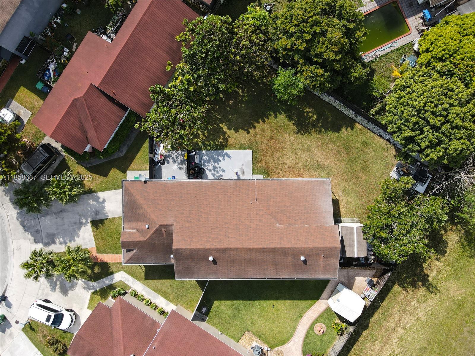 11518 Southwest 174th Street Miami, FL 33157 - Photo 26 of 27 an aerial view of a house with a yard
