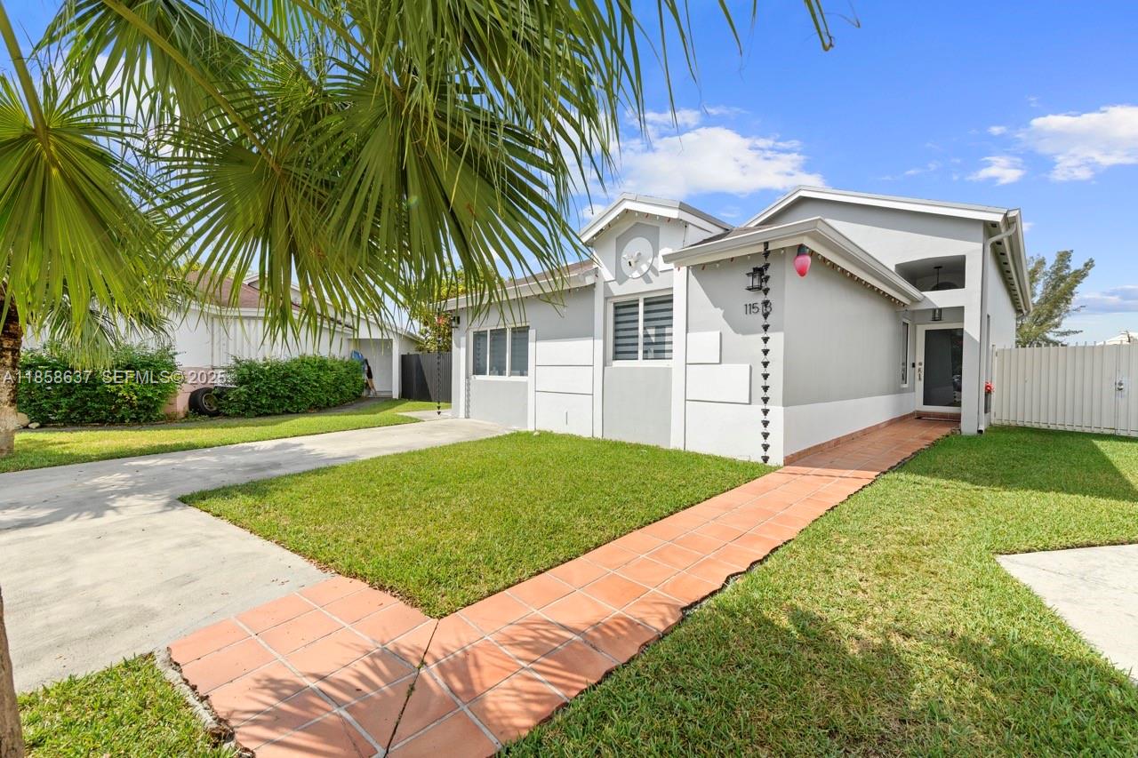 11518 Southwest 174th Street Miami, FL 33157 - Photo 6 of 27 a front view of house with yard and green space