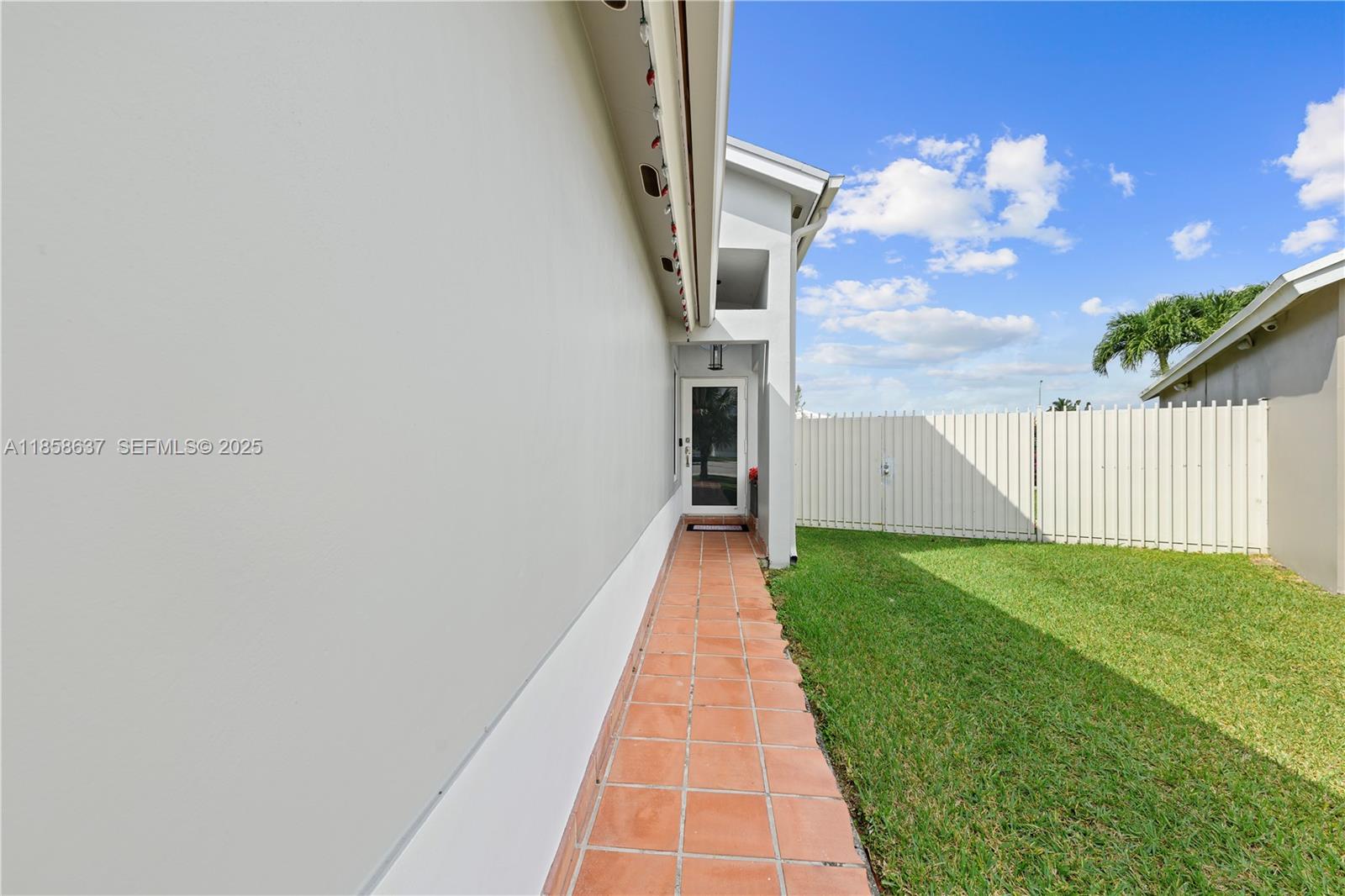 11518 Southwest 174th Street Miami, FL 33157 - Photo 7 of 27 a view of a pathway with a yard