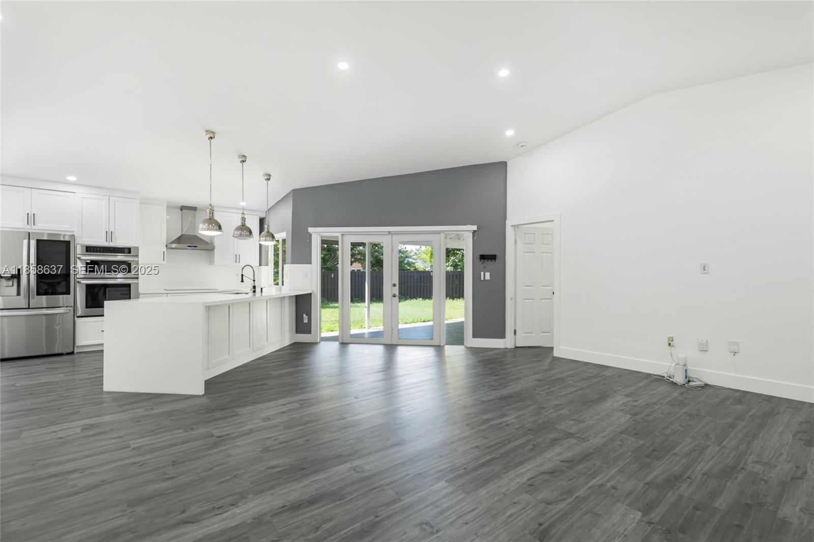 11518 Southwest 174th Street Miami, FL 33157 - Photo 10 of 27 a view of kitchen with furniture and wooden floor