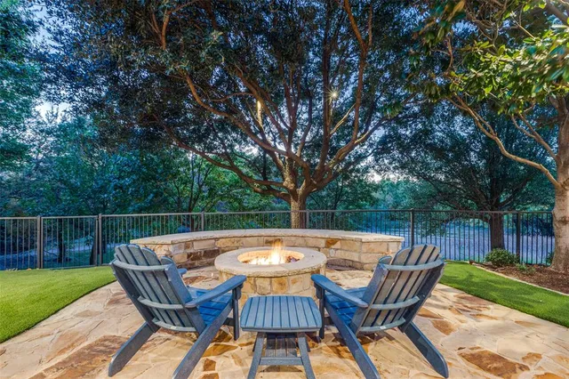 a view of a chairs and table on the patio