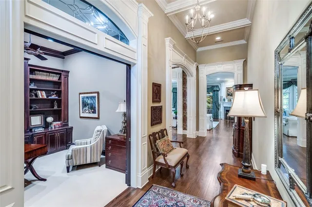 a living room with furniture a lamp and a large window