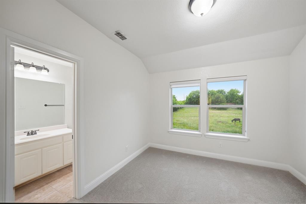 624 Sorrell Road McKinney, TX 75072 - Photo 25 of 28 a view of an empty room with a window and a bathroom