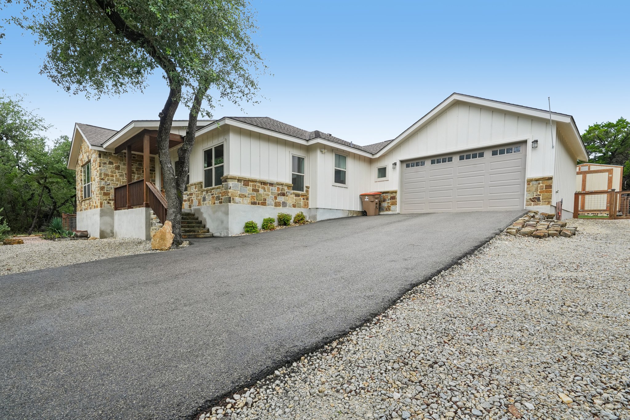 190 Magnolia Meadow Spring Branch, TX 78070 - Photo 21 of 29 A striking exterior combines stone and siding, complemented by an attached garage and a welcoming front entrance.
