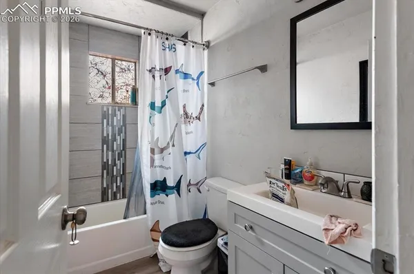 a bathroom with a sink a toilet and a bathtub