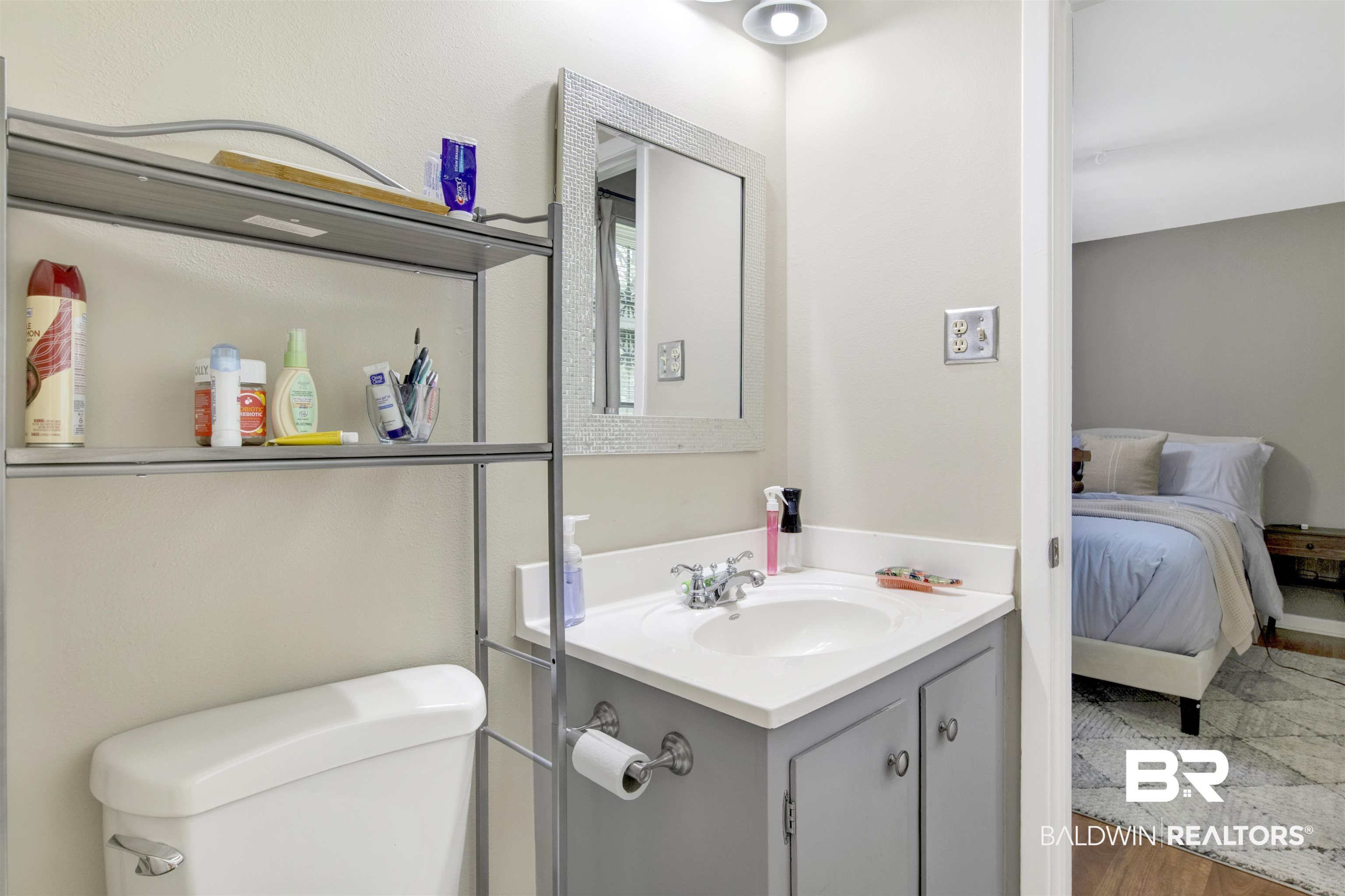 1476 Boudousquie Street Mobile, AL 36605 - Photo 19 of 34 Half bath with vanity and wood finished floors