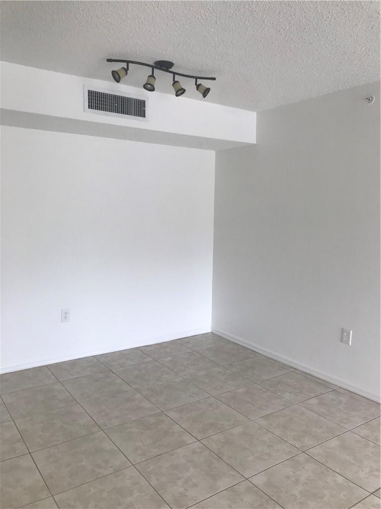 5025 Wiles Road, Unit 207 Coconut Creek, FL 33073 - Photo 4 of 6 a utility room with a sink