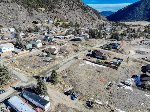 a view of swimming pool with outdoor seating and covered with trees