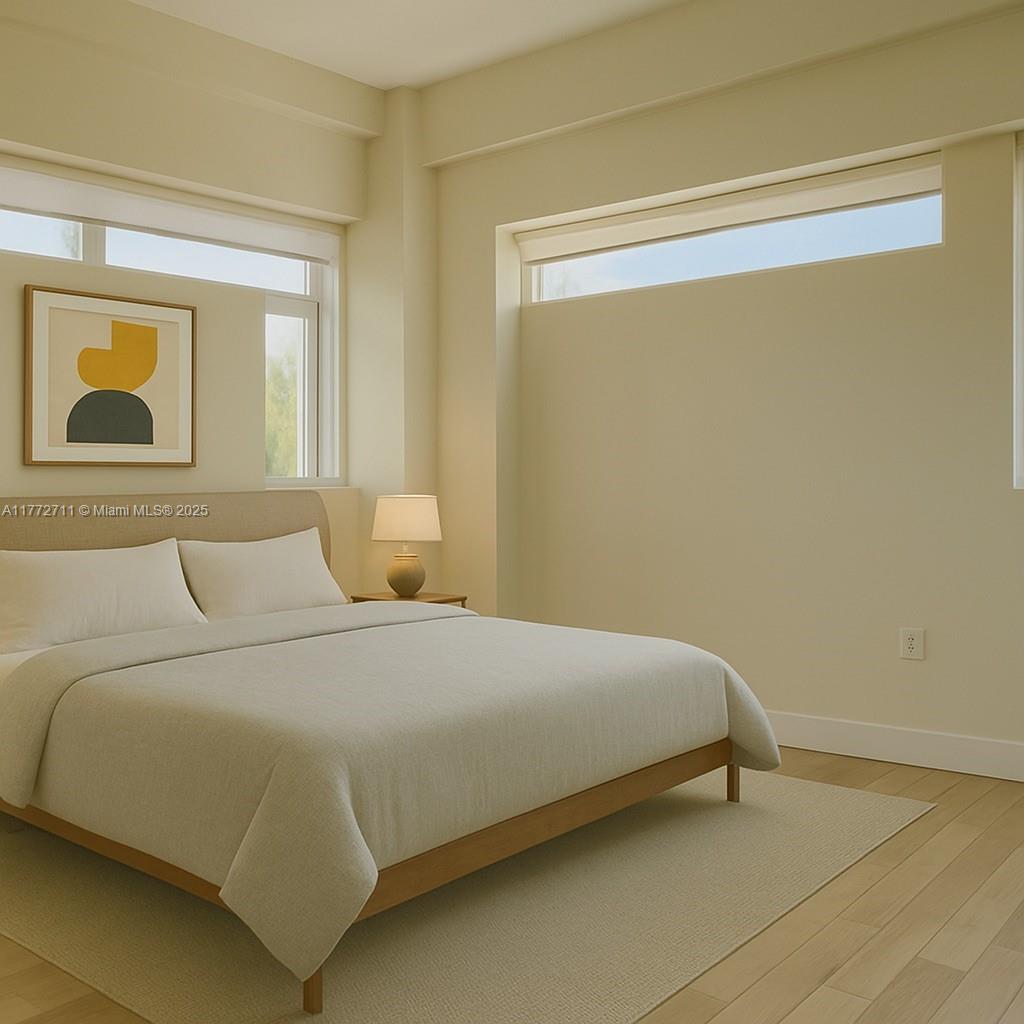 6701 Biscayne Boulevard, Unit 201 Miami, FL 33138 - Photo 15 of 22 a bedroom with a bed and wall painting