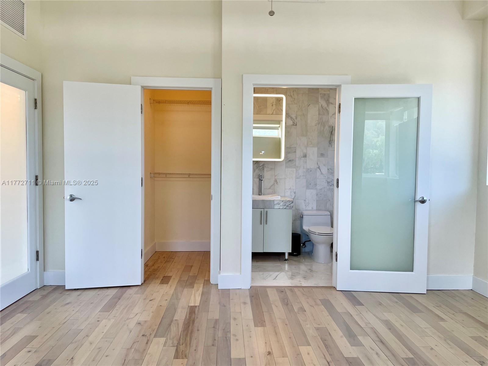 6701 Biscayne Boulevard, Unit 201 Miami, FL 33138 - Photo 17 of 22 a view of a bathroom with a sink and a bathroom