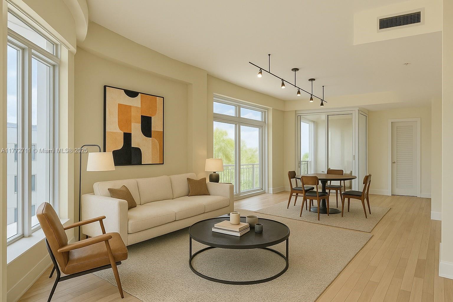 6701 Biscayne Boulevard, Unit 201 Miami, FL 33138 - Photo 5 of 22 a living room with furniture a dining table and a window