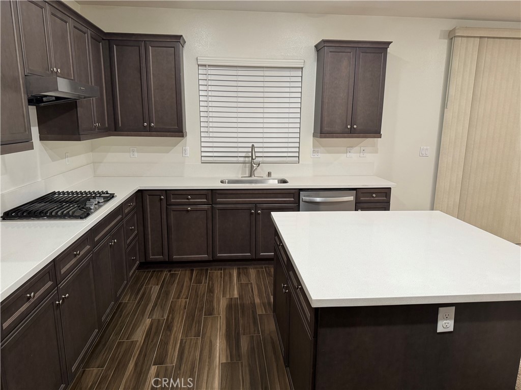 28582 Buttercup Way Moreno Valley, CA 92555 - Photo 12 of 55 a kitchen with a sink and cabinets