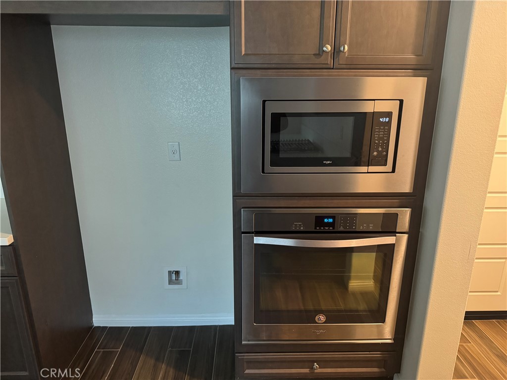 28582 Buttercup Way Moreno Valley, CA 92555 - Photo 14 of 55 a stove top oven sitting inside of a kitchen