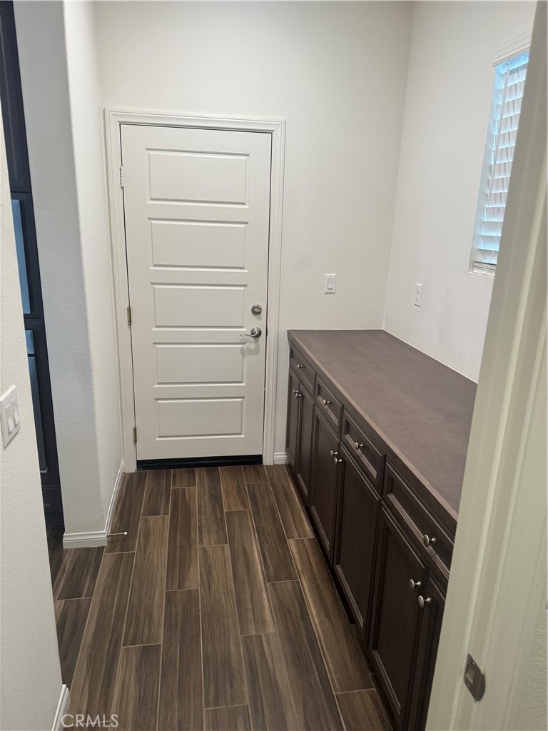 28582 Buttercup Way Moreno Valley, CA 92555 - Photo 19 of 55 a kitchen with a sink and wooden floor