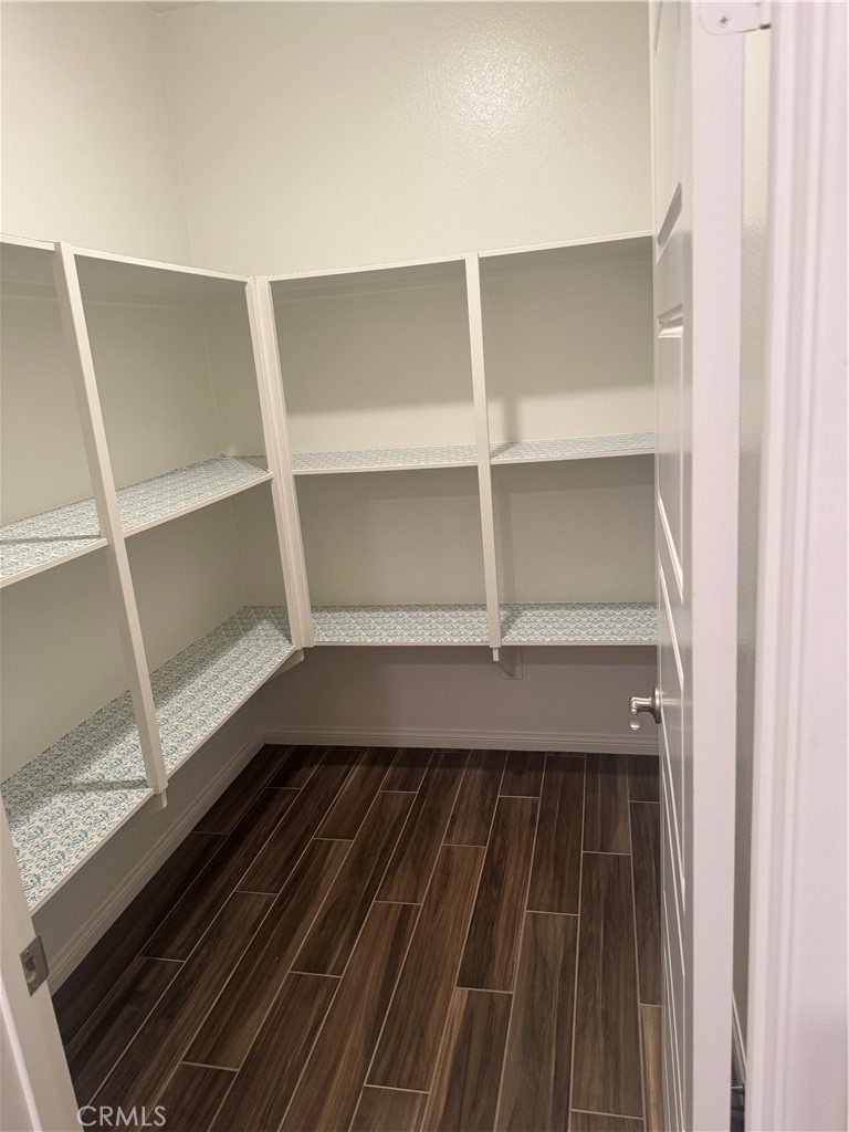 28582 Buttercup Way Moreno Valley, CA 92555 - Photo 21 of 55 a closet with wooden floor