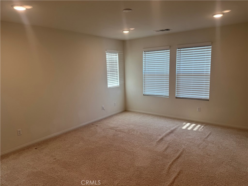 28582 Buttercup Way Moreno Valley, CA 92555 - Photo 28 of 55 a view of an empty room with a window