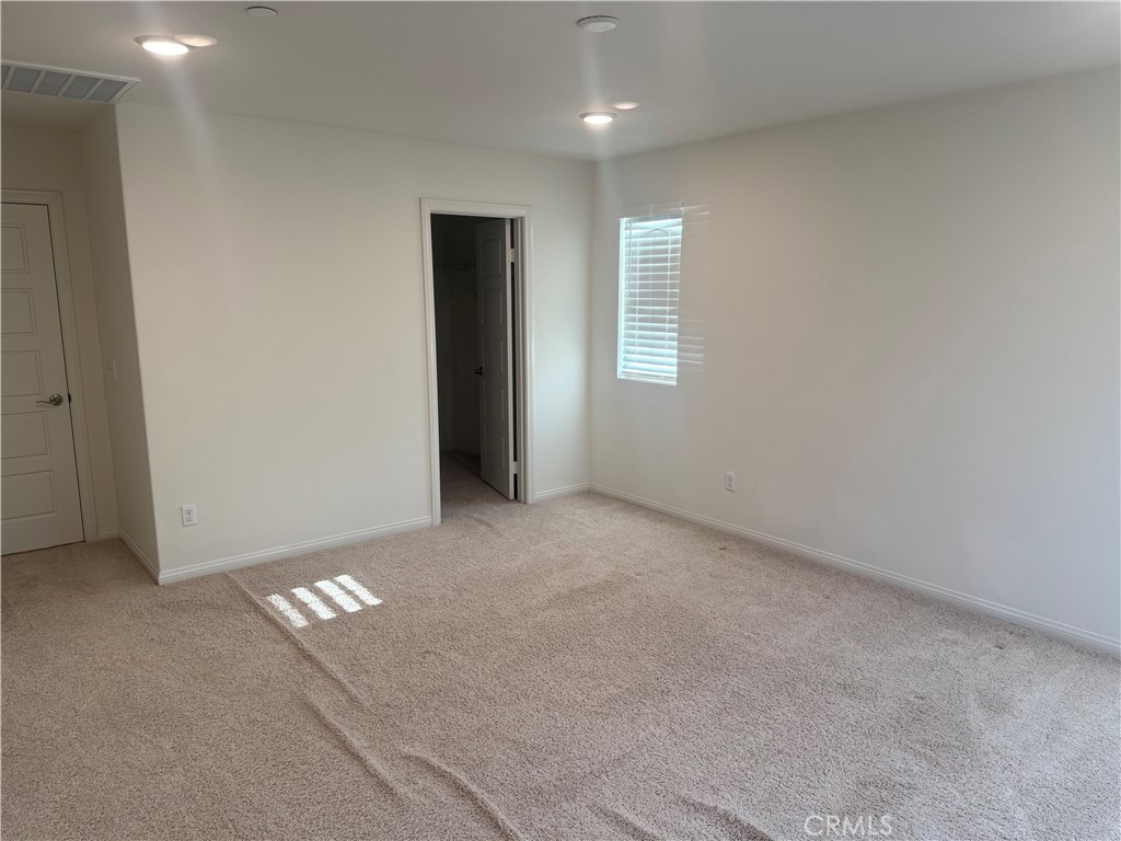 28582 Buttercup Way Moreno Valley, CA 92555 - Photo 29 of 55 a view of an empty room with a window