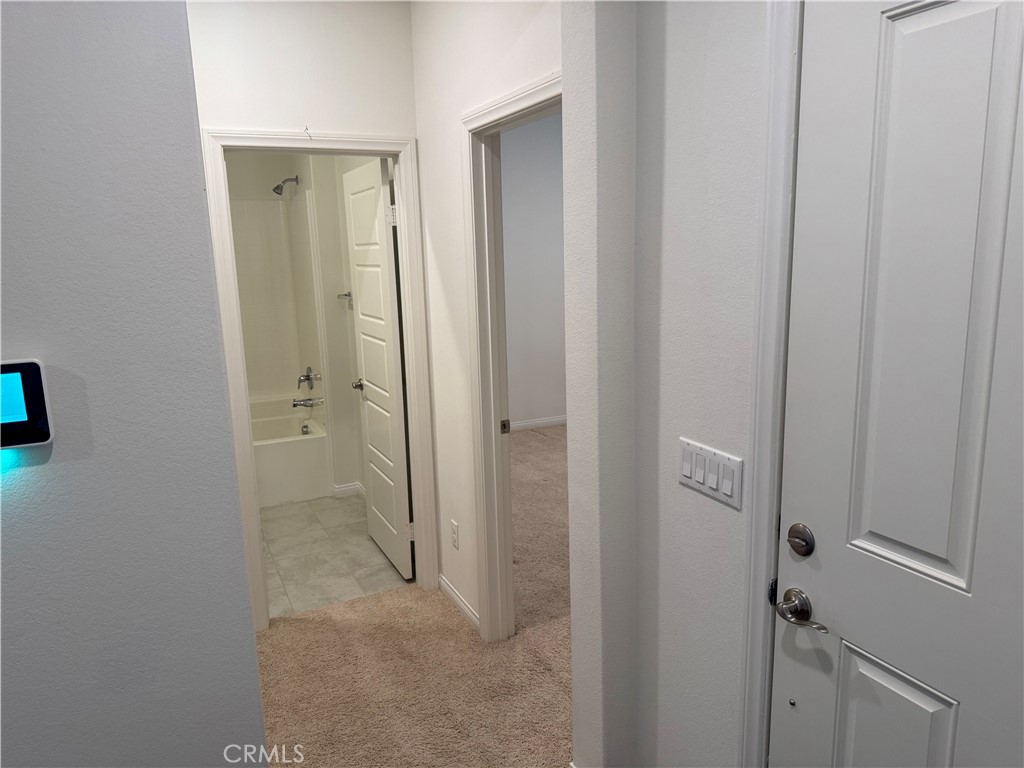 28582 Buttercup Way Moreno Valley, CA 92555 - Photo 38 of 55 a view of a bathroom from the hallway with toilet