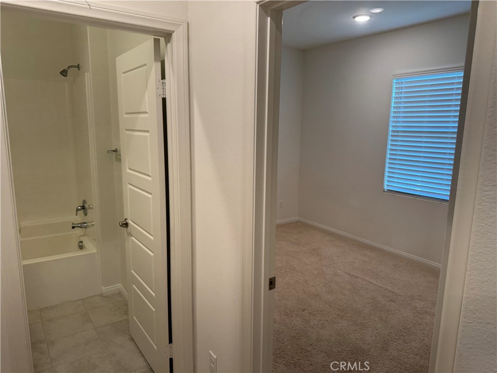 28582 Buttercup Way Moreno Valley, CA 92555 - Photo 39 of 55 a bathroom with a bathtub and a shower