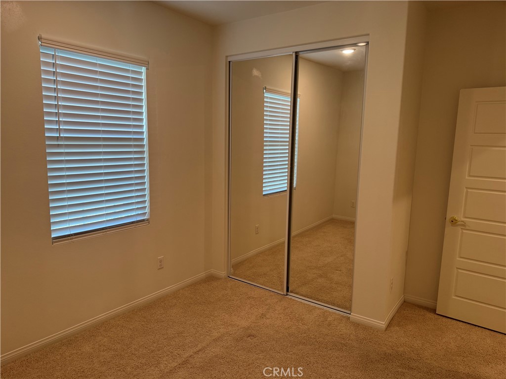 28582 Buttercup Way Moreno Valley, CA 92555 - Photo 40 of 55 a view of an empty room with window and a bathroom