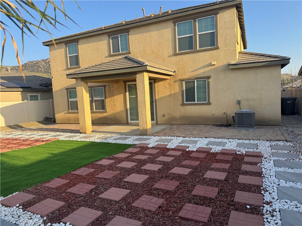 28582 Buttercup Way Moreno Valley, CA 92555 - Photo 51 of 55 a front view of a house with a yard