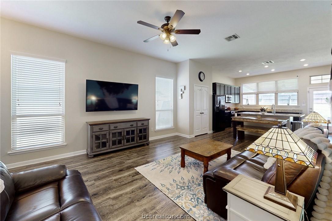 2071 Positano Loop Bryan, TX 77808 - Photo 7 of 31 a living room with furniture and a flat screen tv