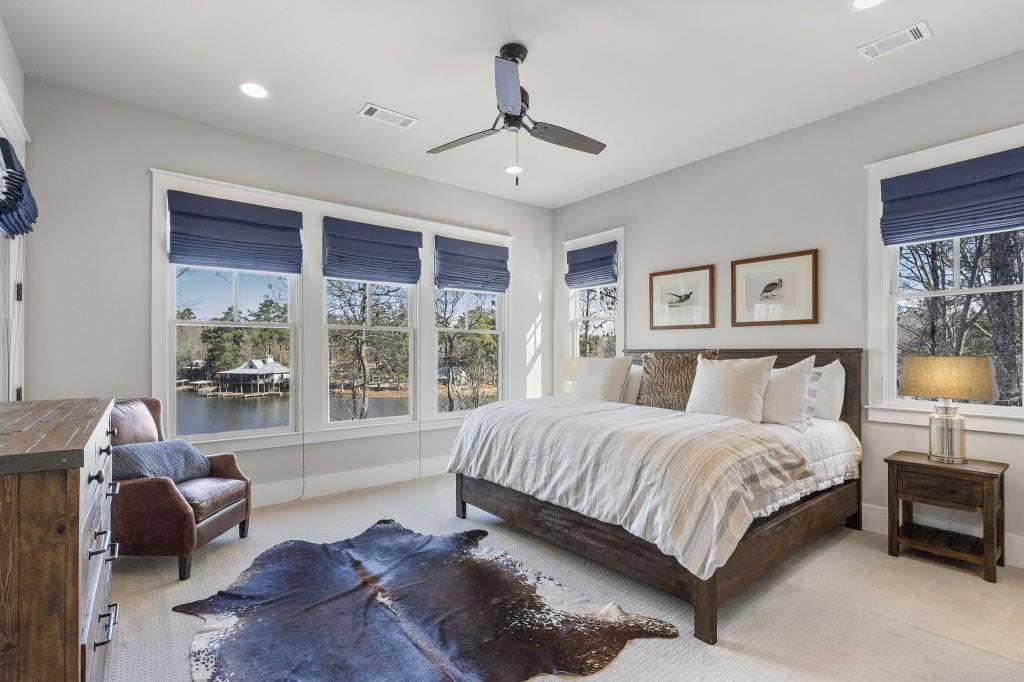72 Buckeye Ridge Newnan, GA 30263 - Photo 19 of 80 a spacious bedroom with a bed and a chandelier
