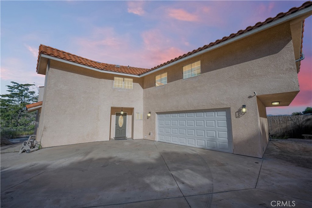 24974 Wiley Canyon Road Newhall, CA 91321 - Photo 1 of 1 a front view of a house with a yard