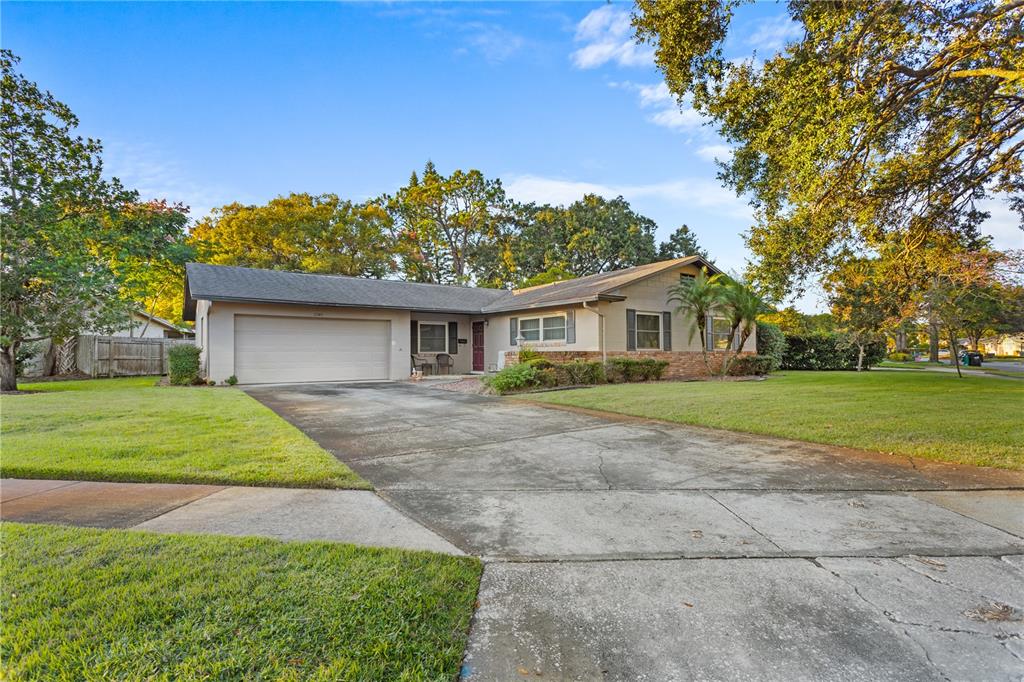 2743 Merrie Oaks Road Winter Park, FL 32792 - Photo 1 of 1 a front view of house with yard and green space