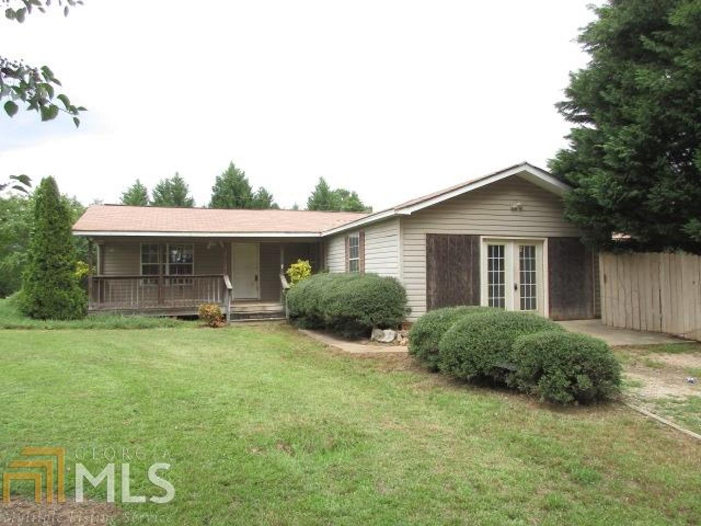 a front view of house with yard and seating area