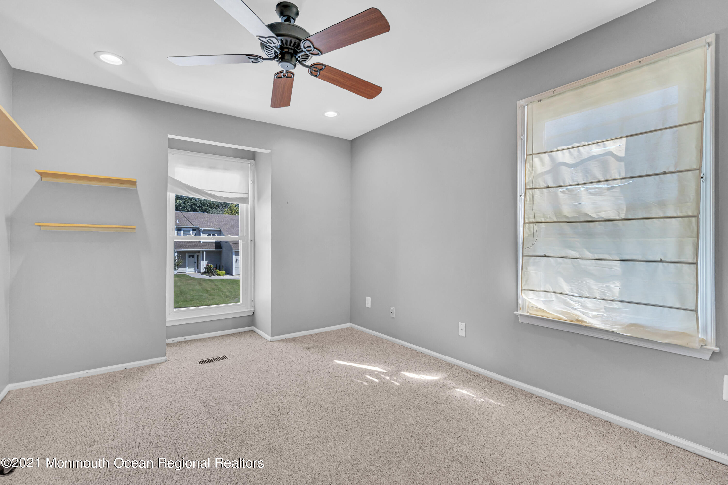 16 Marc Drive Howell, NJ 07731 - Photo 18 of 29 an empty room with windows and cabinet