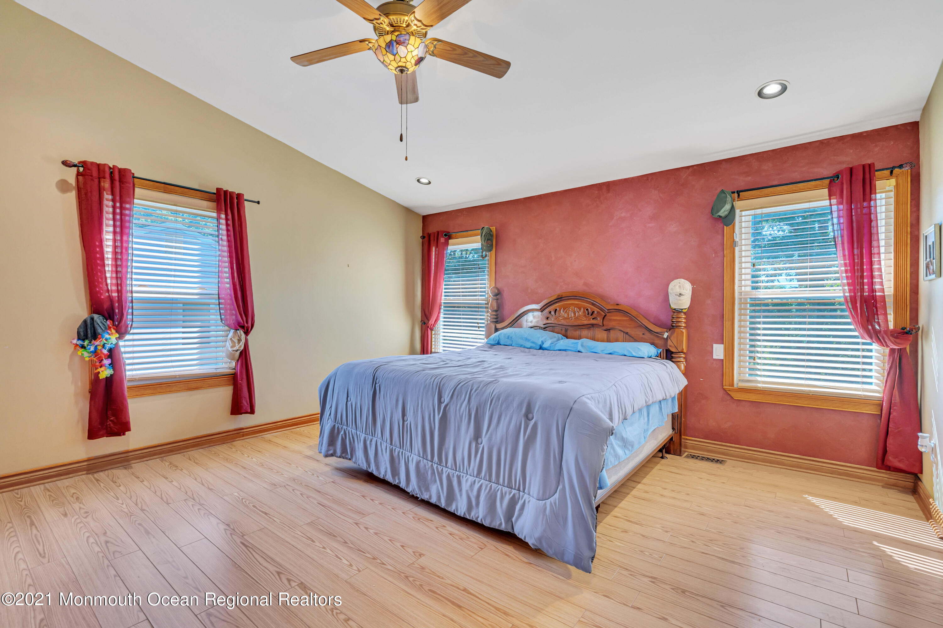 16 Marc Drive Howell, NJ 07731 - Photo 20 of 29 a bedroom with a bed and a chandelier