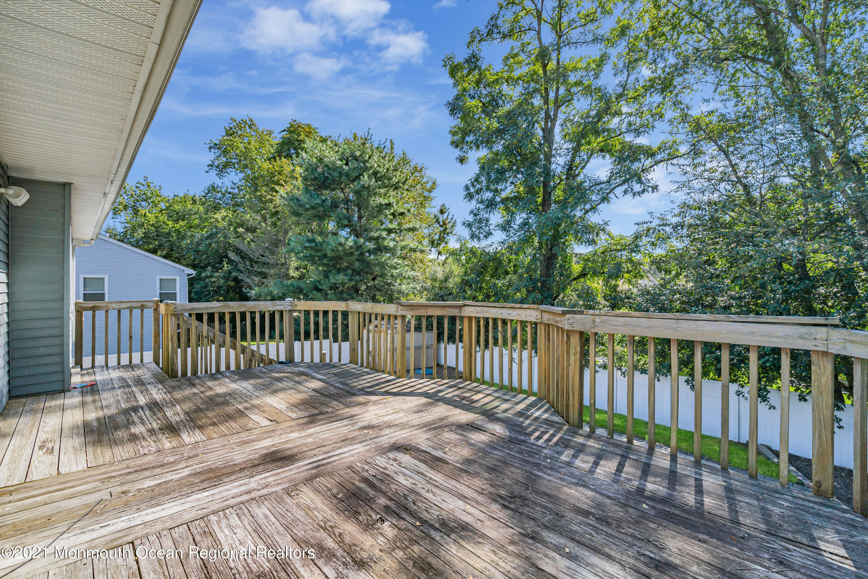 16 Marc Drive Howell, NJ 07731 - Photo 22 of 29 a view of a wooden roof deck
