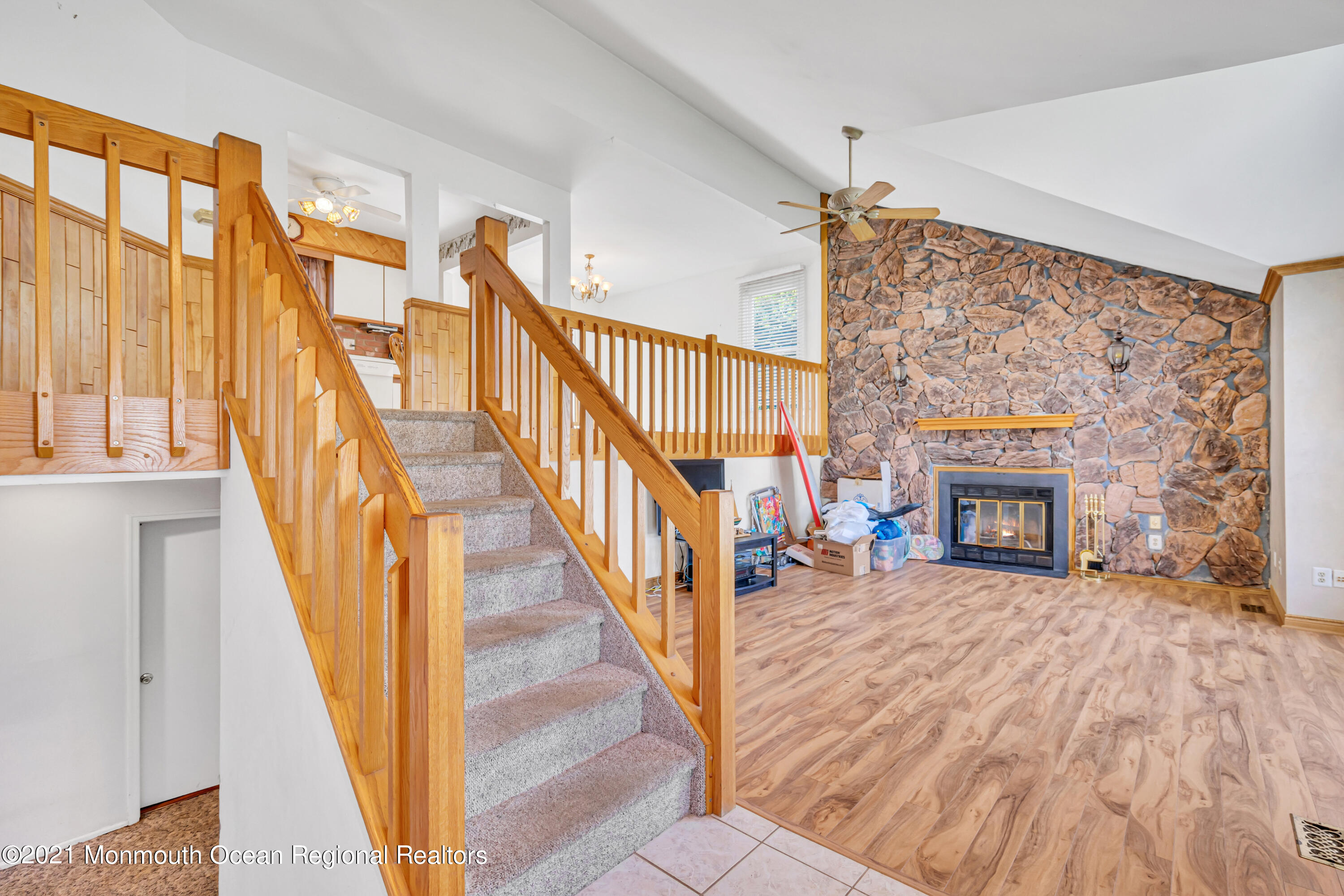 16 Marc Drive Howell, NJ 07731 - Photo 4 of 29 a view of an entryway with wooden floor fireplace and a window
