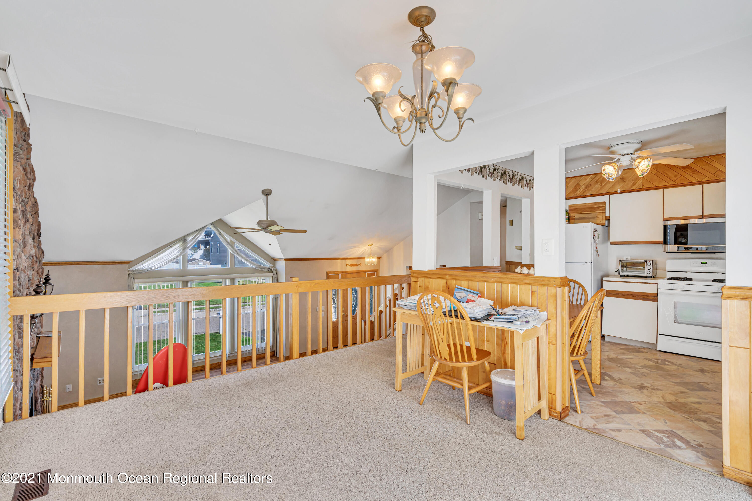 16 Marc Drive Howell, NJ 07731 - Photo 10 of 29 a view of a dining room with furniture wooden floor and chandelier