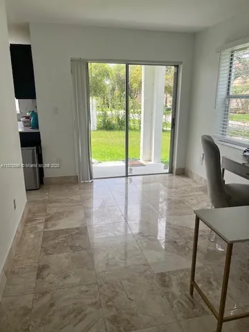 a view of an empty room with a window