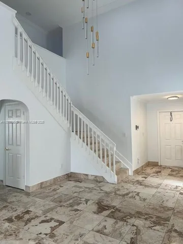 a view of a hallway with staircase