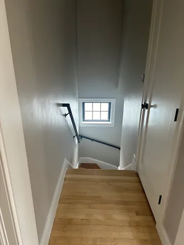 a bedroom with bed and window