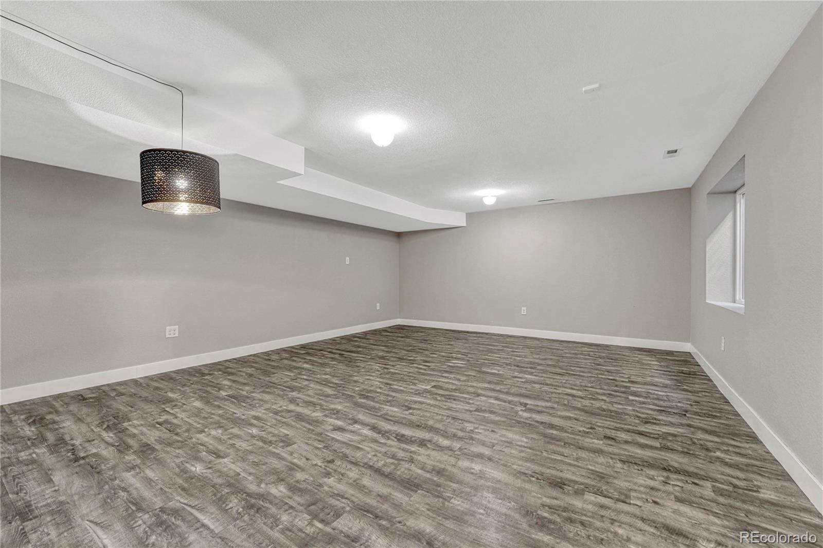 923 Raleigh Street Denver, CO 80204 - Photo 24 of 35 a view of an empty room with a window