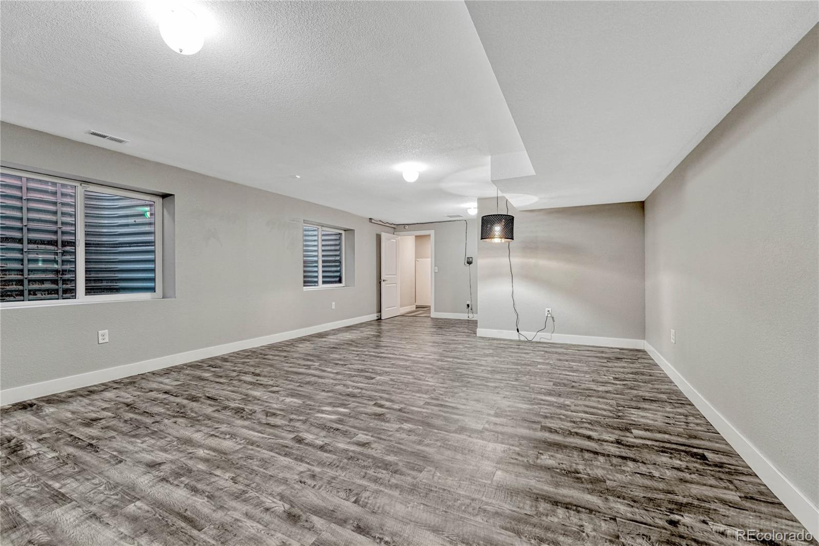923 Raleigh Street Denver, CO 80204 - Photo 26 of 35 a view of empty room with wooden floor