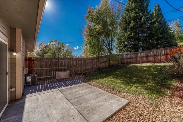 a view of a bench in the backyard