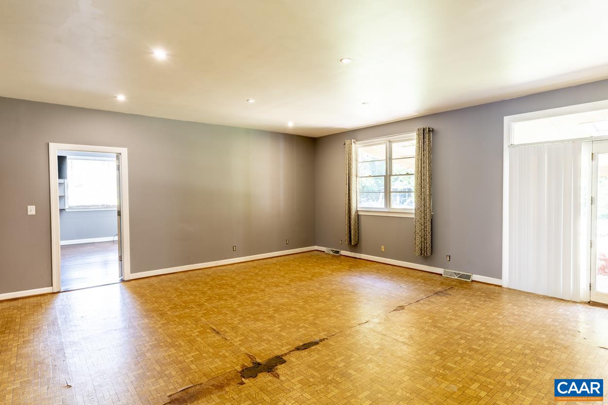 1118 Wolf Trap Road Charlottesville, VA 22911 - Photo 29 of 64 a view of an empty room with window and wooden floor